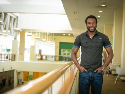 Student standing in the Recreation Center bridge
